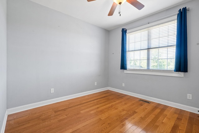 767 Dixie Ln, Pleasant View, TN 37146 - unfurnished room with ceiling fan, light wood-style floors, and baseboards