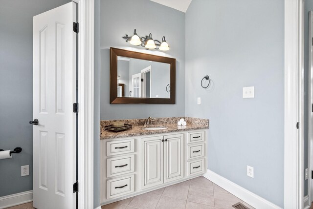 767 Dixie Ln, Pleasant View, TN 37146 - bathroom featuring vanity, baseboards, and tile patterned floors