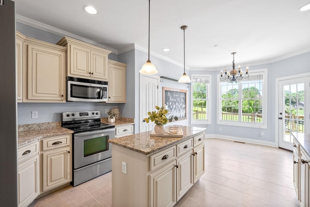 767 Dixie Ln, Pleasant View, TN 37146 - kitchen with cream cabinets, appliances with stainless steel finishes, a chandelier, a center island, and light stone counters