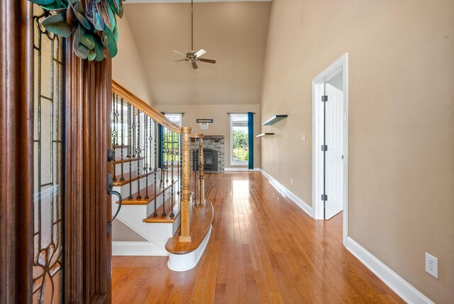767 Dixie Ln, Pleasant View, TN 37146 - entryway with baseboards, a ceiling fan, wood finished floors, high vaulted ceiling, and stairs