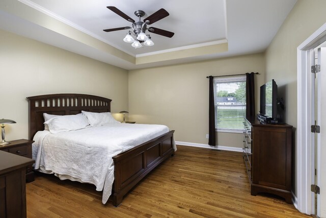2815 Windy Way, Thompsons Station, TN 37179 - bedroom featuring ornamental molding, wood finished floors, baseboards, a tray ceiling, and a ceiling fan