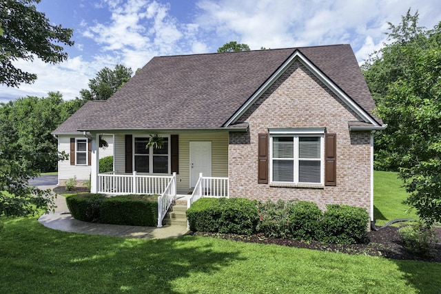 2815 Windy Way, Thompsons Station, TN 37179 - view of front of property with a porch, a front lawn, a shingled roof, and brick siding
