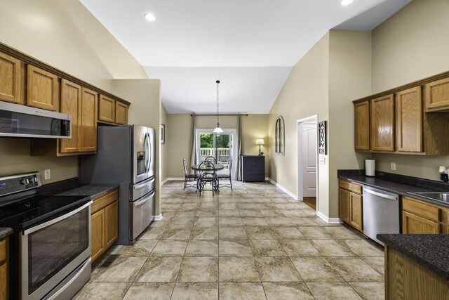 2815 Windy Way, Thompsons Station, TN 37179 - kitchen featuring stainless steel appliances, baseboards, brown cabinets, pendant lighting, and recessed lighting