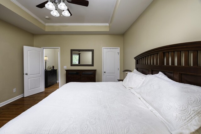 2815 Windy Way, Thompsons Station, TN 37179 - bedroom featuring dark wood-style floors, a raised ceiling, ornamental molding, baseboards, and a ceiling fan