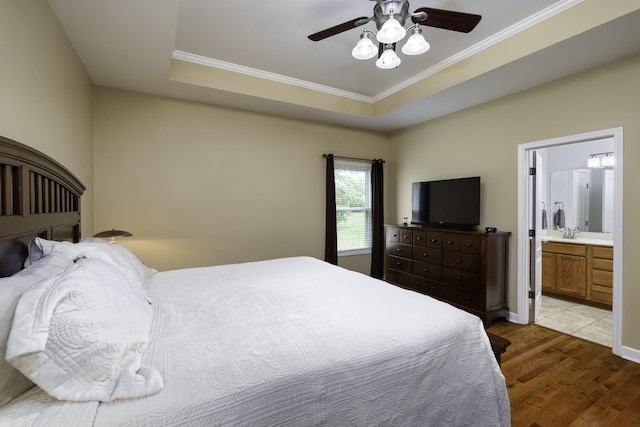 2815 Windy Way, Thompsons Station, TN 37179 - bedroom with light wood-style flooring, crown molding, connected bathroom, a ceiling fan, and a tray ceiling