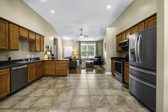 2815 Windy Way, Thompsons Station, TN 37179 - kitchen with stainless steel appliances, dark countertops, lofted ceiling, open floor plan, and ceiling fan