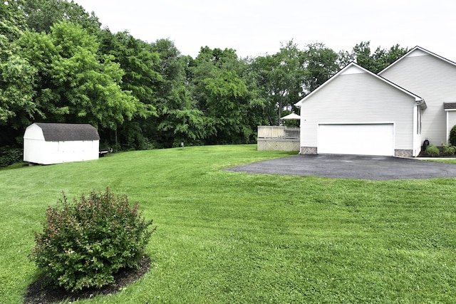 2815 Windy Way, Thompsons Station, TN 37179 - view of grassy yard featuring driveway and a garage