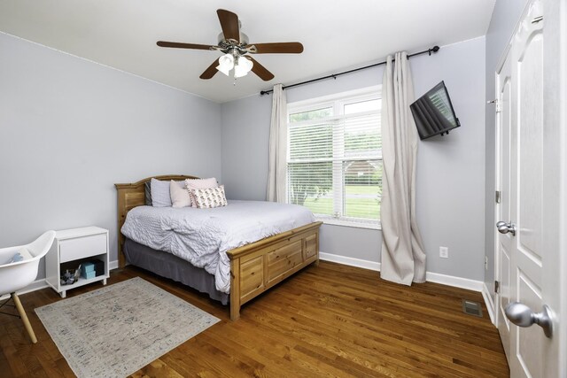2815 Windy Way, Thompsons Station, TN 37179 - bedroom with dark wood-style floors, baseboards, and a ceiling fan