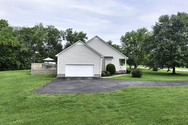 2815 Windy Way, Thompsons Station, TN 37179 - view of front of home with asphalt driveway, a deck, a front yard, and an attached garage