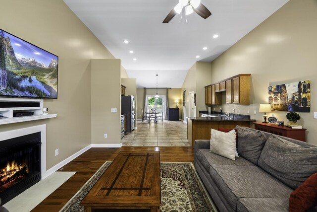 2815 Windy Way, Thompsons Station, TN 37179 - living area with a ceiling fan, a fireplace with flush hearth, light wood-style floors, recessed lighting, and baseboards