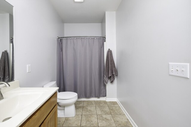 2815 Windy Way, Thompsons Station, TN 37179 - full bath with toilet, vanity, a shower with shower curtain, tile patterned floors, and baseboards