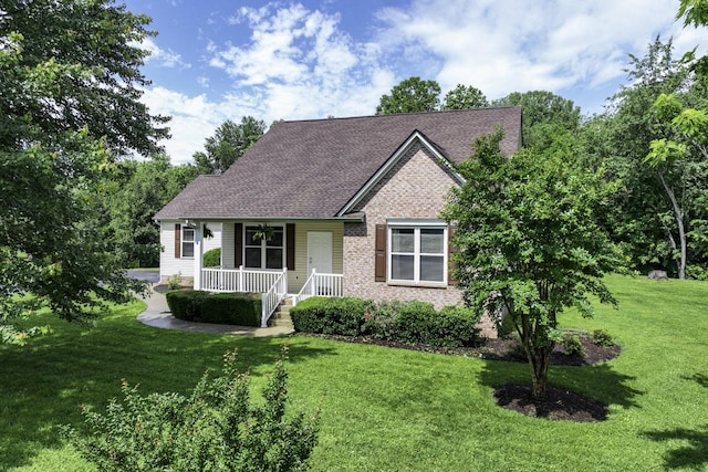 2815 Windy Way, Thompsons Station, TN 37179 - view of front facade with covered porch, a front lawn, brick siding, and a shingled roof