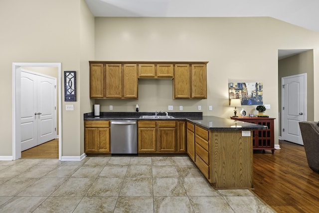 2815 Windy Way, Thompsons Station, TN 37179 - kitchen featuring dishwasher, a sink, brown cabinetry, a peninsula, and baseboards