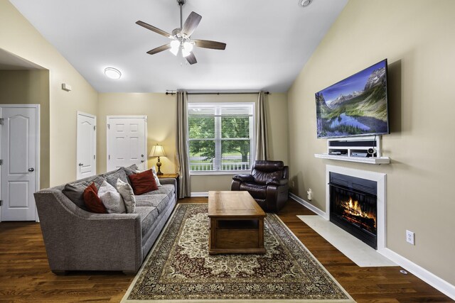 2815 Windy Way, Thompsons Station, TN 37179 - living room featuring vaulted ceiling, a ceiling fan, wood finished floors, a fireplace with flush hearth, and baseboards