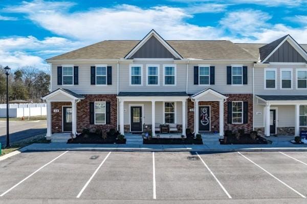 166 Grayson Cir, Chapel Hill, TN 37034 - view of property featuring board and batten siding, brick siding, and a porch
