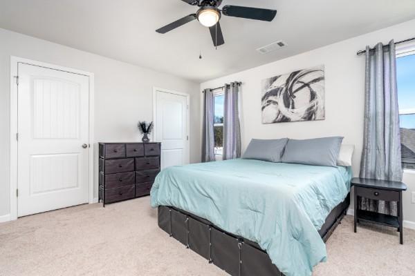 166 Grayson Cir, Chapel Hill, TN 37034 - carpeted bedroom with baseboards and a ceiling fan