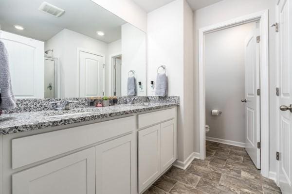 166 Grayson Cir, Chapel Hill, TN 37034 - bathroom with double vanity, toilet, baseboards, recessed lighting, and a shower with shower door
