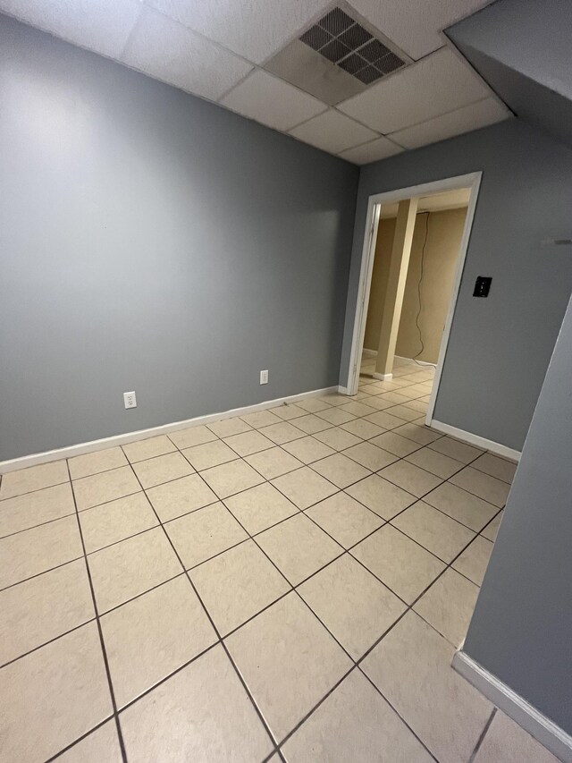 924 Granny White Rd, Clarksville, TN 37040 - unfurnished room featuring a paneled ceiling, light tile patterned flooring, and baseboards
