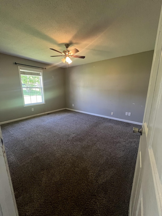 924 Granny White Rd, Clarksville, TN 37040 - unfurnished room with dark carpet, a textured ceiling, ceiling fan, and baseboards