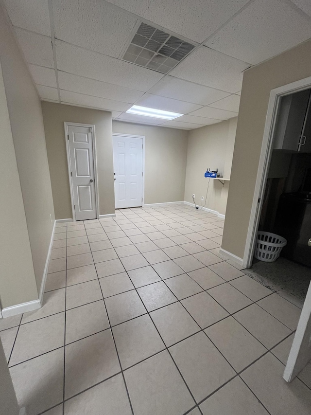 924 Granny White Rd, Clarksville, TN 37040 - below grade area featuring a paneled ceiling, light tile patterned flooring, and baseboards