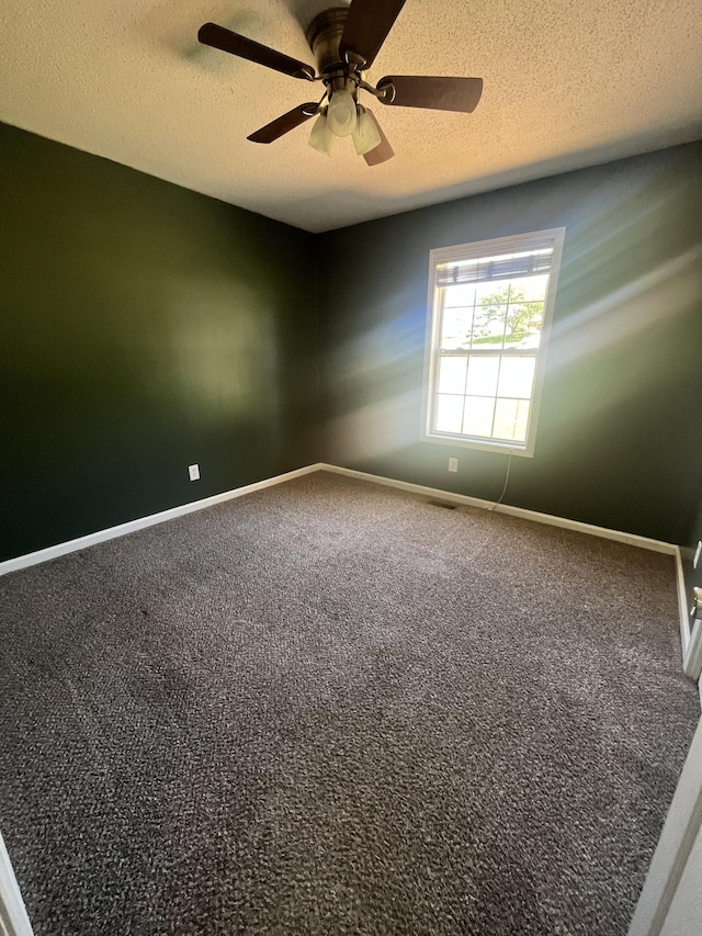 924 Granny White Rd, Clarksville, TN 37040 - spare room with a textured ceiling, carpet flooring, ceiling fan, and baseboards