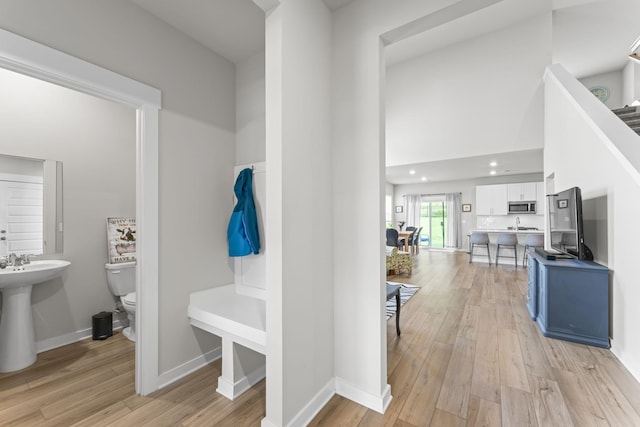 360 Gulfstream Dr, Gallatin, TN 37066 - mudroom featuring light wood-style floors, baseboards, a sink, and recessed lighting