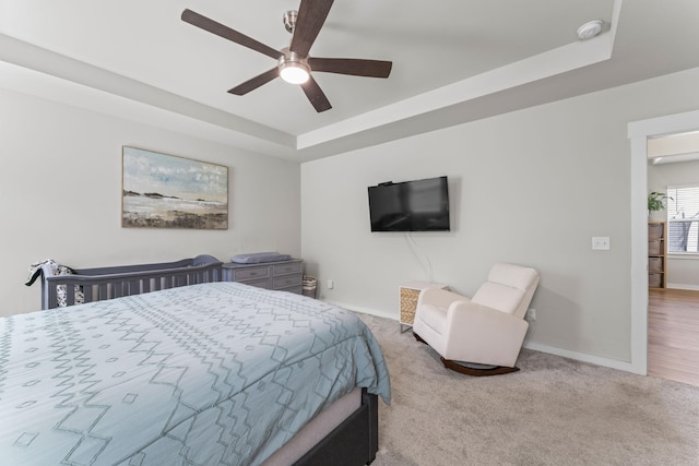 360 Gulfstream Dr, Gallatin, TN 37066 - carpeted bedroom featuring a raised ceiling, baseboards, and a ceiling fan
