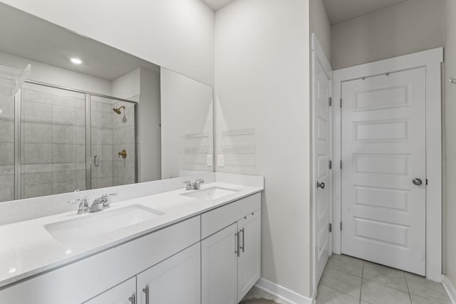 360 Gulfstream Dr, Gallatin, TN 37066 - full bathroom with double vanity, a shower stall, tile patterned floors, and baseboards