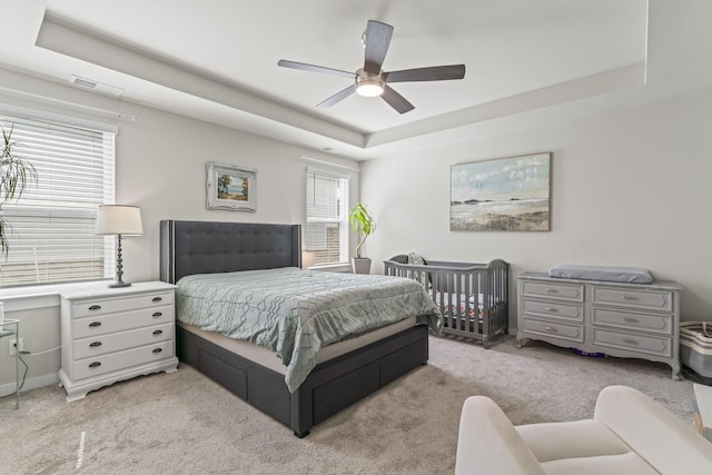 360 Gulfstream Dr, Gallatin, TN 37066 - bedroom with a tray ceiling, light colored carpet, and ceiling fan
