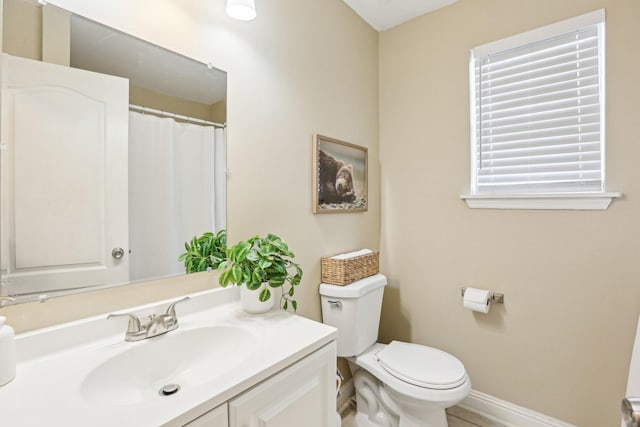 3408 Bruner Ct, Nashville, TN 37211 - bathroom featuring vanity, toilet, and baseboards