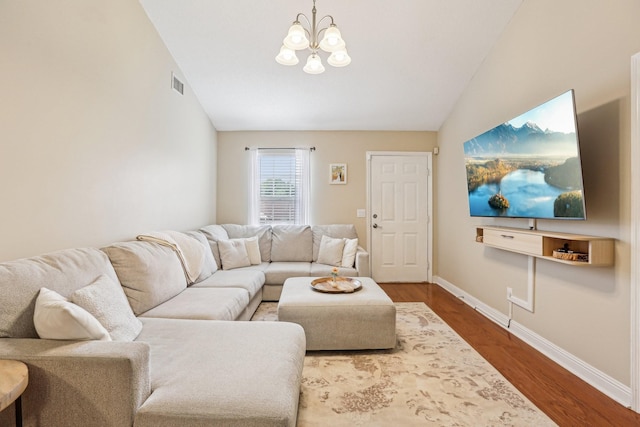3408 Bruner Ct, Nashville, TN 37211 - living area with lofted ceiling, a chandelier, wood finished floors, and baseboards
