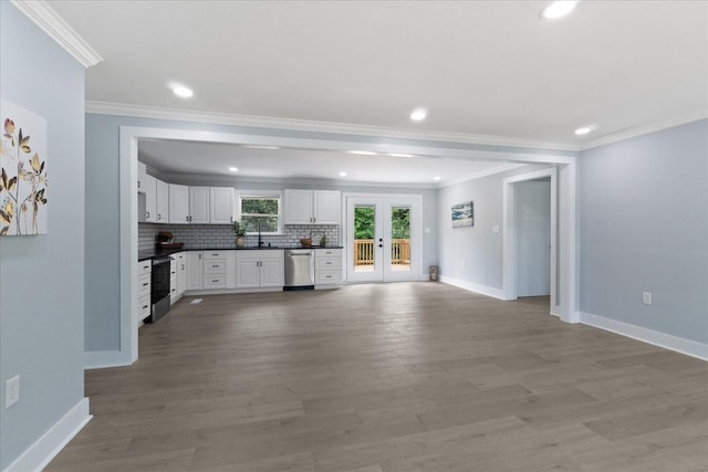 244 Beartown Rd S, Loretto, TN 38469 - unfurnished living room featuring crown molding, baseboards, light wood finished floors, recessed lighting, and french doors