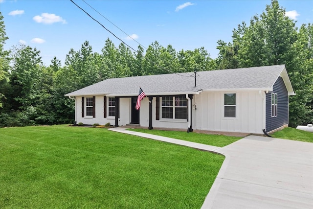 244 Beartown Rd S, Loretto, TN 38469 - single story home with board and batten siding, a front lawn, roof with shingles, and driveway