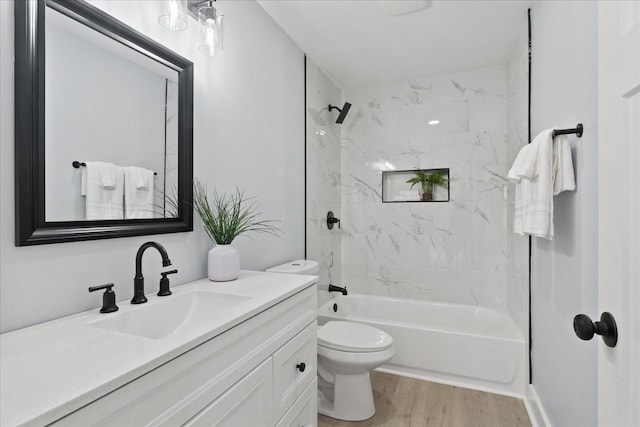 244 Beartown Rd S, Loretto, TN 38469 - full bath featuring vanity, toilet, wood finished floors, and washtub / shower combination