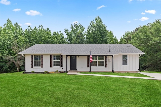 244 Beartown Rd S, Loretto, TN 38469 - ranch-style home with board and batten siding, a front lawn, and roof with shingles