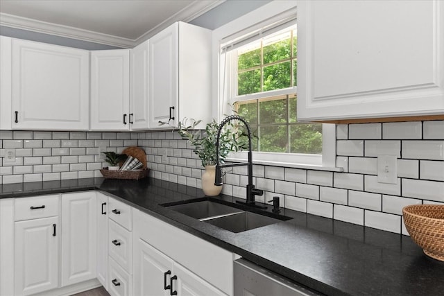 244 Beartown Rd S, Loretto, TN 38469 - kitchen featuring a sink, dark countertops, stainless steel dishwasher, white cabinets, and backsplash