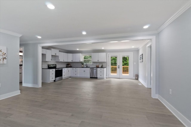 244 Beartown Rd S, Loretto, TN 38469 - kitchen with appliances with stainless steel finishes, dark countertops, baseboards, tasteful backsplash, and crown molding