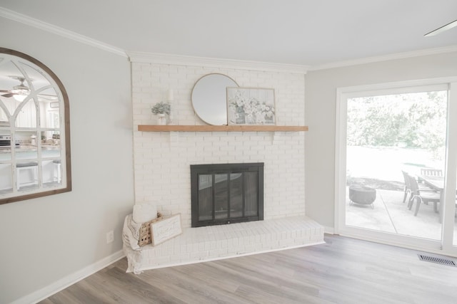 204 Tyne Blvd, Old Hickory, TN 37138 - unfurnished living room with ornamental molding, wood finished floors, ceiling fan, a brick fireplace, and baseboards