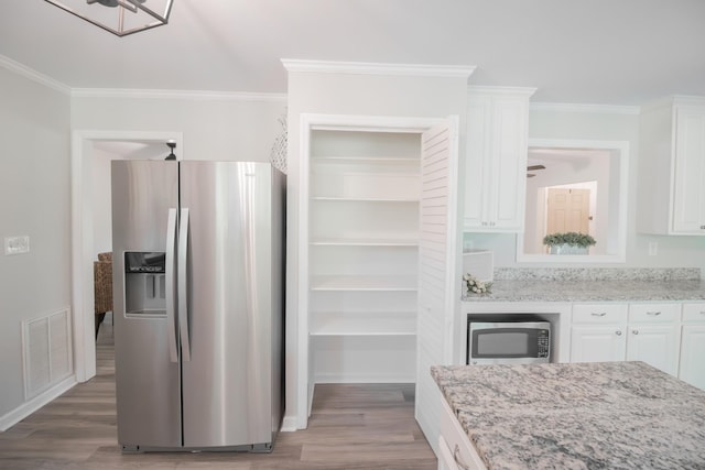 204 Tyne Blvd, Old Hickory, TN 37138 - kitchen with stainless steel appliances, white cabinets, crown molding, wood finished floors, and light stone counters
