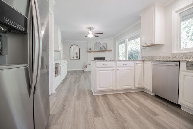 204 Tyne Blvd, Old Hickory, TN 37138 - kitchen with stainless steel appliances, plenty of natural light, white cabinetry, and crown molding