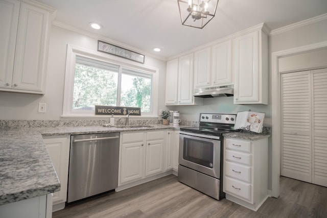 204 Tyne Blvd, Old Hickory, TN 37138 - kitchen featuring appliances with stainless steel finishes, under cabinet range hood, a sink, crown molding, and white cabinets