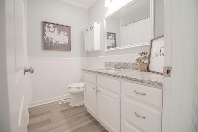 204 Tyne Blvd, Old Hickory, TN 37138 - full bathroom with vanity, toilet, a wainscoted wall, wood finished floors, and ornamental molding