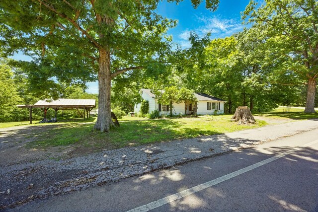 3148 Rawlings Rd, Woodlawn, TN 37191 - view of front of home with a carport and a front yard