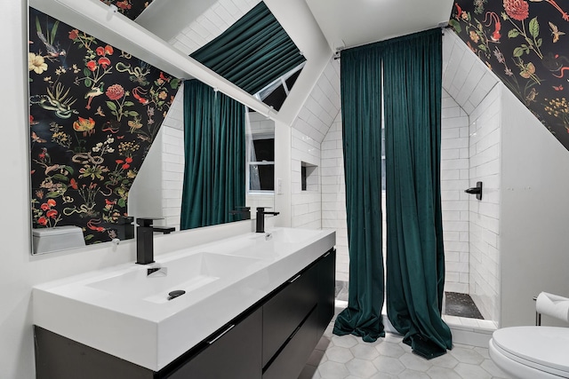 1211 Stratford Ave, Nashville, TN 37216 - bathroom featuring toilet, double vanity, a shower stall, and tile patterned flooring