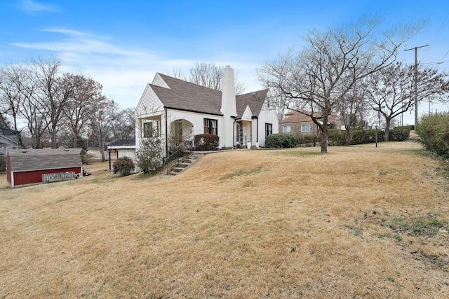 1211 Stratford Ave, Nashville, TN 37216 - view of property exterior with a chimney and a yard