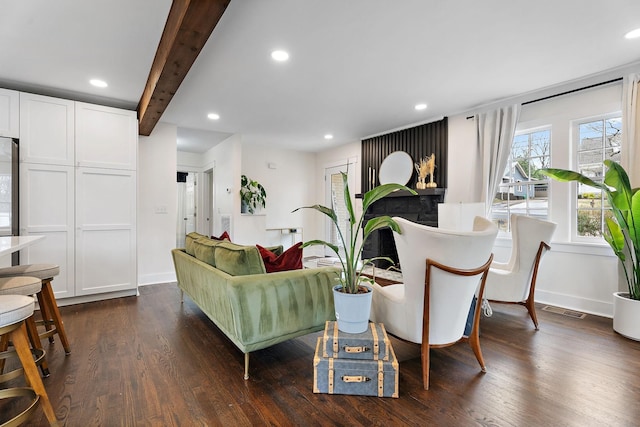 1211 Stratford Ave, Nashville, TN 37216 - living area with dark wood-style flooring, recessed lighting, beamed ceiling, baseboards, and a fireplace