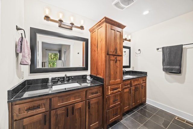 100 Station Dr, Waverly, TN 37185 - full bath featuring double vanity, tile patterned floors, and baseboards