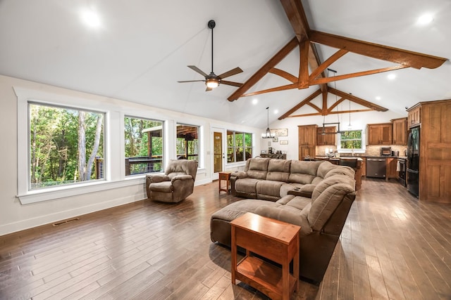 100 Station Dr, Waverly, TN 37185 - living area with a ceiling fan, beamed ceiling, dark wood finished floors, high vaulted ceiling, and baseboards