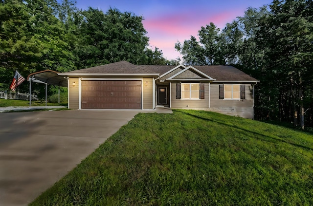 100 Station Dr, Waverly, TN 37185 - ranch-style house featuring a front yard, driveway, an attached garage, and a carport