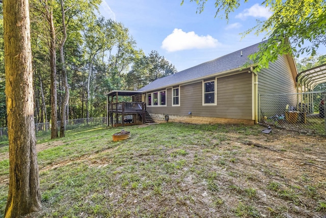 100 Station Dr, Waverly, TN 37185 - rear view of property with a wooden deck, stairs, and an outdoor fire pit
